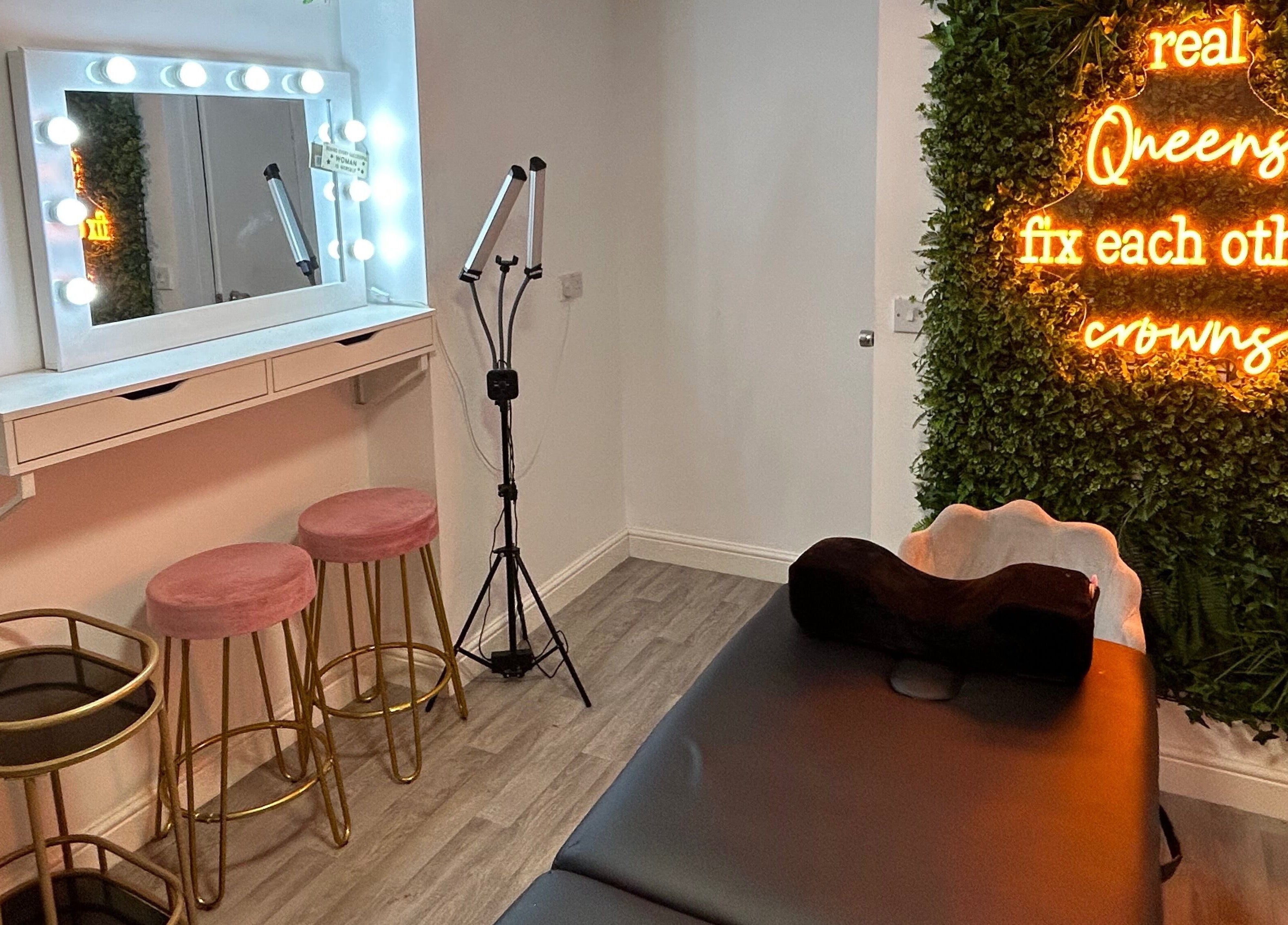 Modern beauty room at The SAS Sanctuary and Academy, Stockport, England, GB with lighted mirror and quote wall.