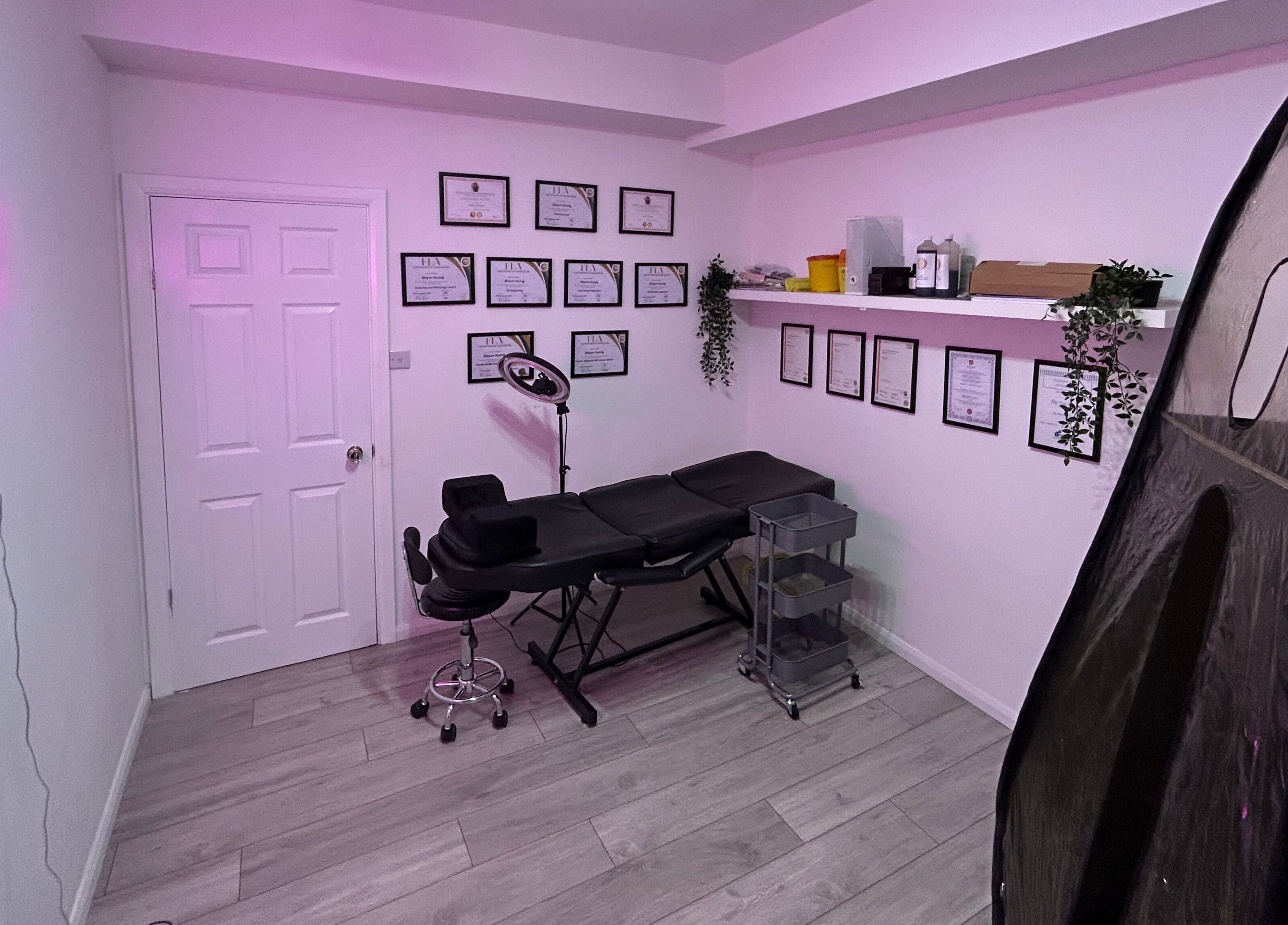 Treatment room at The SAS Sanctuary and Academy, Stockport, England, GB with a massage table and ambient lighting.