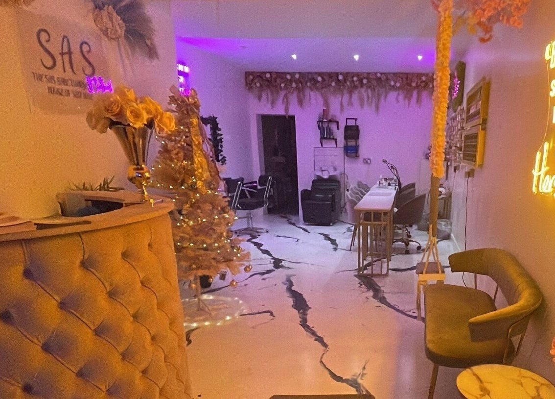 Chic interior of The SAS Sanctuary and Academy, Stockport, England; cozy seats, warm lighting, and stylish decor.