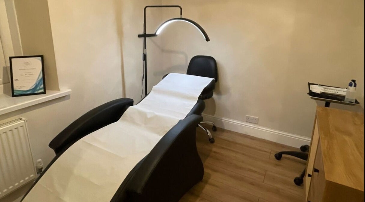 Calming treatment room at The Beauty Lab UK, Abercarn, Wales, GB with a relaxing chair and ambient lighting.