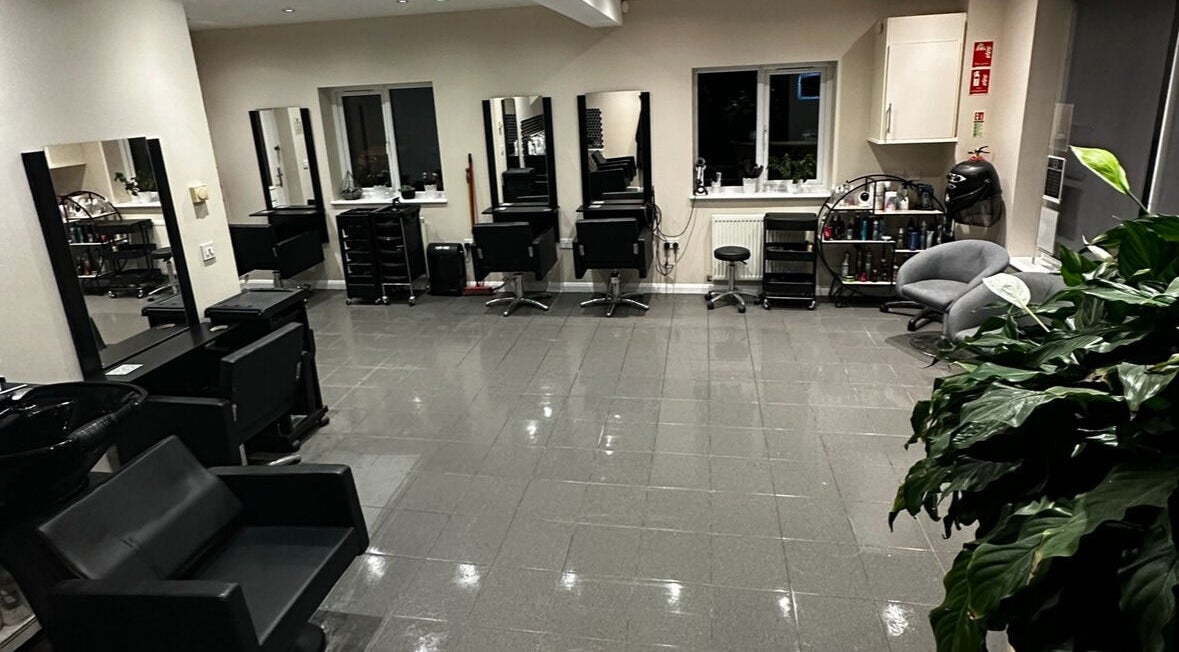 Spacious interior of Hair by Jade in Bridgnorth, England, GB, featuring elegant styling stations.