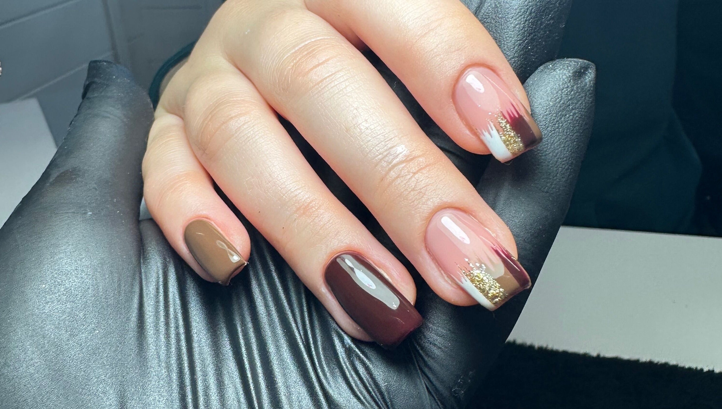 Stylish nail art with brown and gold at Klbeauty, Runcorn, England, GB.