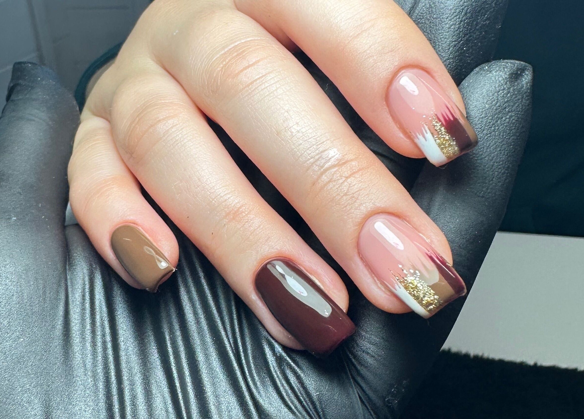 Stylish nail art with brown and gold at Klbeauty, Runcorn, England, GB.