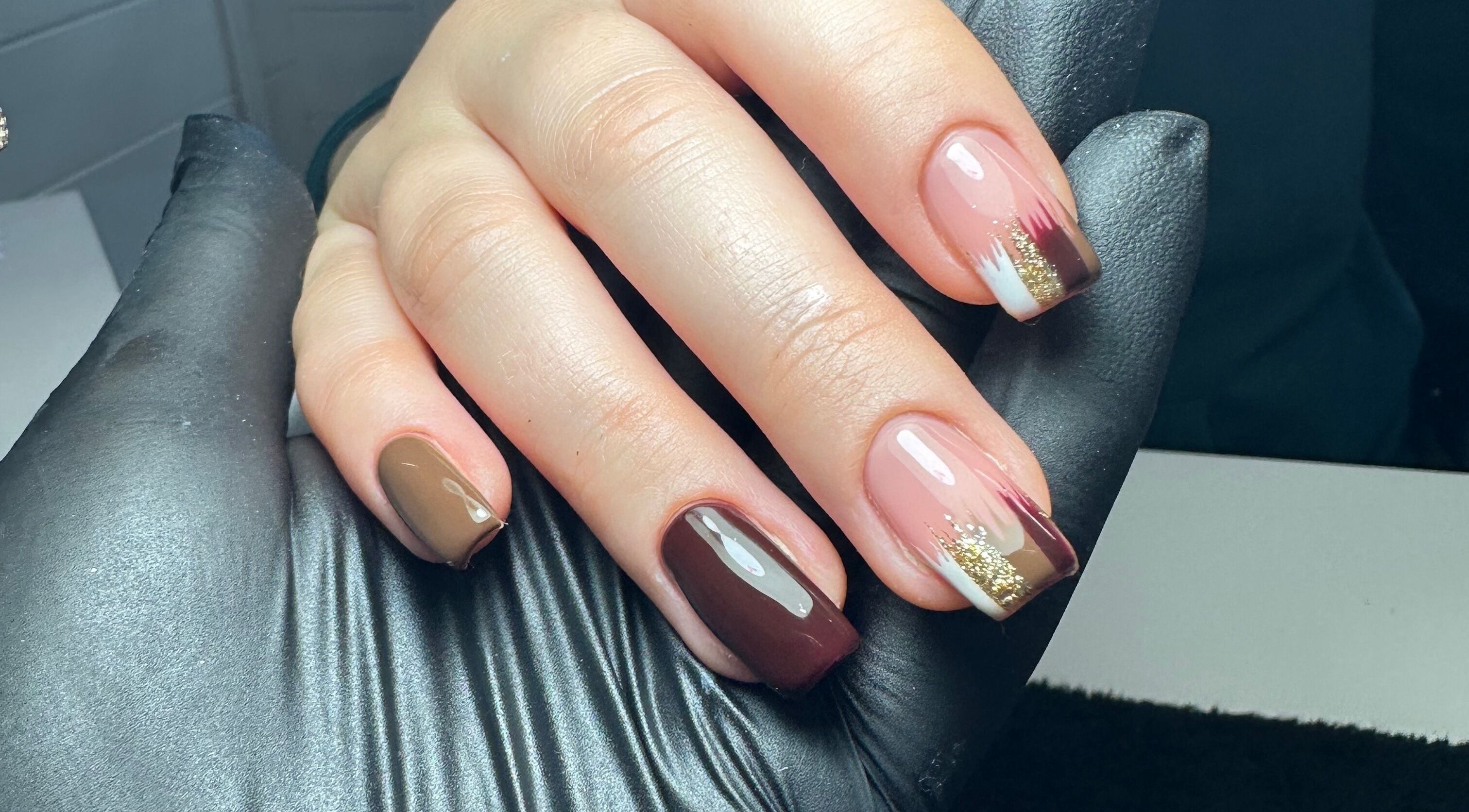 Stylish nail art with brown and gold at Klbeauty, Runcorn, England, GB.