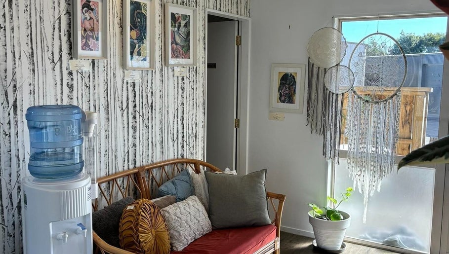 Relaxing corner at Trish Strike beauty in Tauranga, Bay of Plenty, NZ with rattan sofa and dreamcatchers.