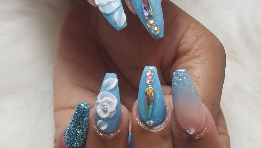 Stylish blue nail art with 3D flowers at Teaser's Nail Care, Bridgetown, Saint James, BB.