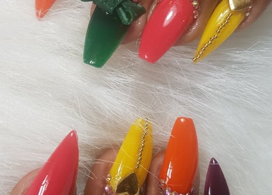 Vibrant nail art at Teaser's Nail Care, Bridgetown, Saint James, BB. Explore bold colors and intricate designs.