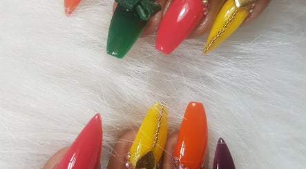 Vibrant nail art at Teaser's Nail Care, Bridgetown, Saint James, BB. Explore bold colors and intricate designs.