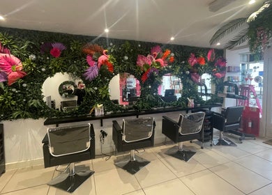 Lush floral decor enhances the serene salon atmosphere at Hair at O’Neills, Fareham, England, GB.