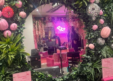 Vibrant floral and mirror decor at Hair at O’Neills, Fareham, England, GB, showcasing chic salon ambiance.