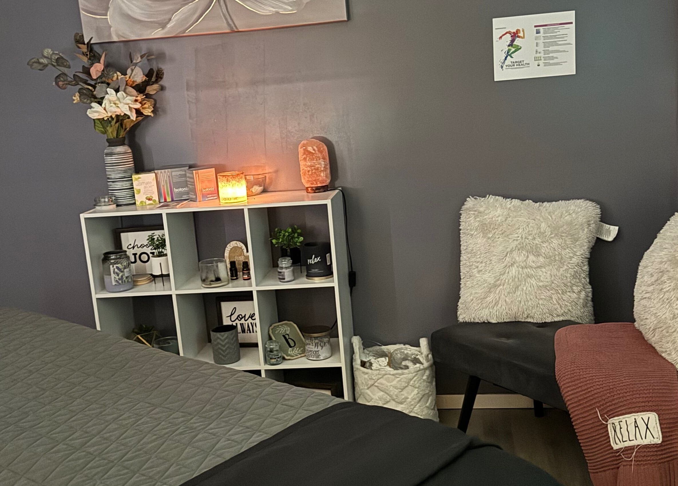 Cozy corner of Hands on Healing in Coalinga, California, US with fluffy chairs and ambient lighting.