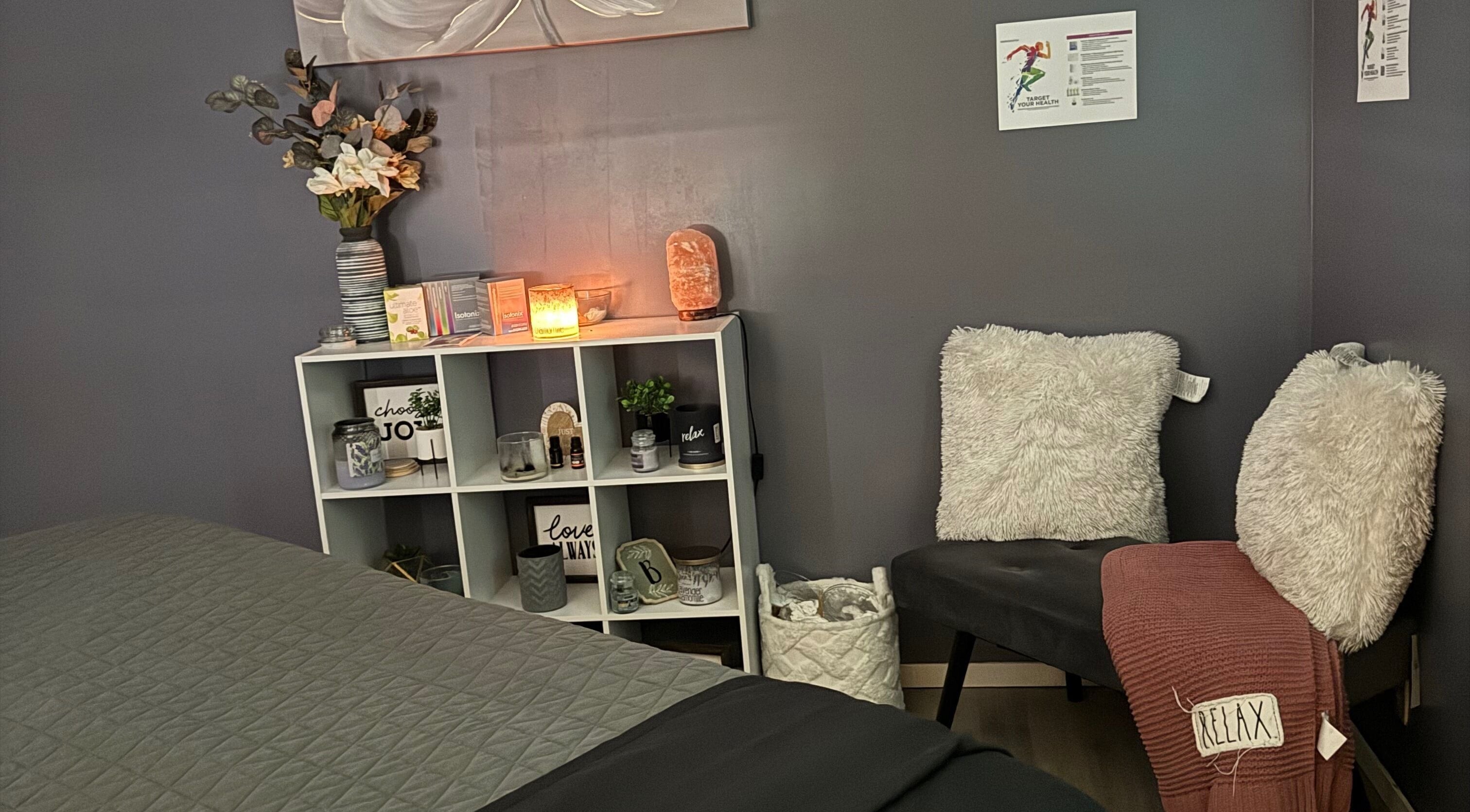 Cozy corner of Hands on Healing in Coalinga, California, US with fluffy chairs and ambient lighting.