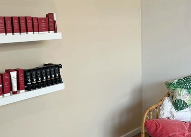 Product display and cozy seating at Nudie Skin Studio, Melbourne, Victoria, AU for a relaxing beauty experience.