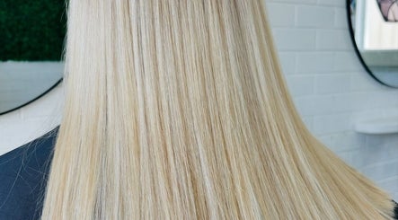 Smooth blonde hair styled at Tathra HairStudio, Tathra, New South Wales, AU with sleek, straight finish.