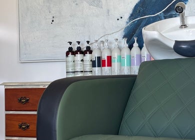 Comfortable salon chair and products at Tathra HairStudio, Tathra, New South Wales, AU.
