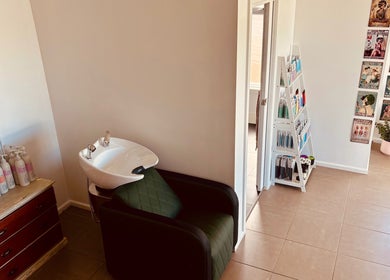 Modern wash station and decor at Tathra HairStudio, Tathra, New South Wales, AU, showcasing salon ambiance.