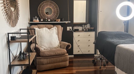 Tranquil spa room at Beauty Bar 11, Flinders View, Queensland, AU with plush seating and elegant decor.