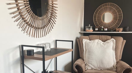 Cozy lounge corner at Beauty Bar 11, Flinders View, Queensland, AU with stylish decor and plush seating.