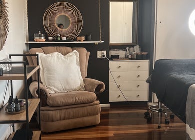 Inviting beauty room at Beauty Bar 11, Flinders View, Queensland, AU with plush seating and ambient lighting.