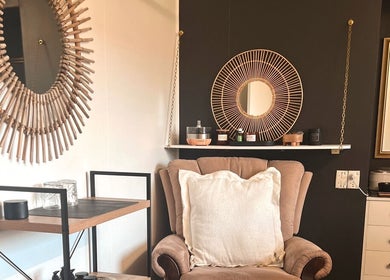 Cozy relaxation corner in Beauty Bar 11, Flinders View, Queensland, AU with elegant decor and comfortable seating.
