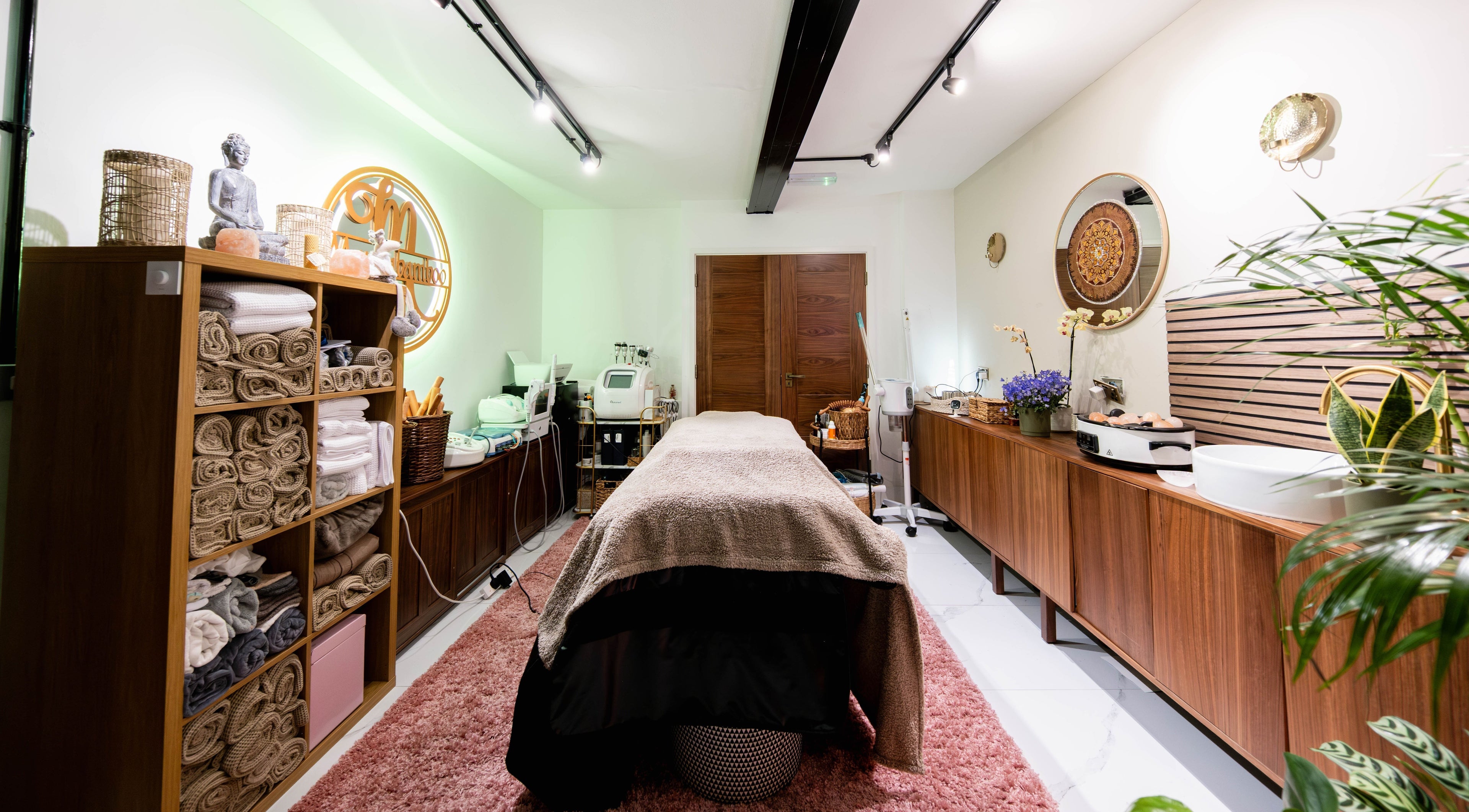 Relaxing massage room at Marcia Bamboo Massage Therapist, London, England, GB, featuring tranquil decor and amenities.