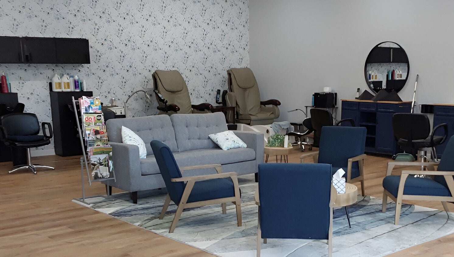 Cozy seating area at Serendipity Hair and Nails, Davison, Michigan, US, with modern decor and salon chairs.