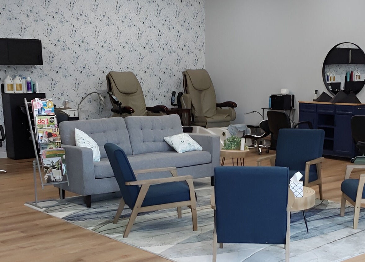 Cozy seating area at Serendipity Hair and Nails, Davison, Michigan, US, with modern decor and salon chairs.