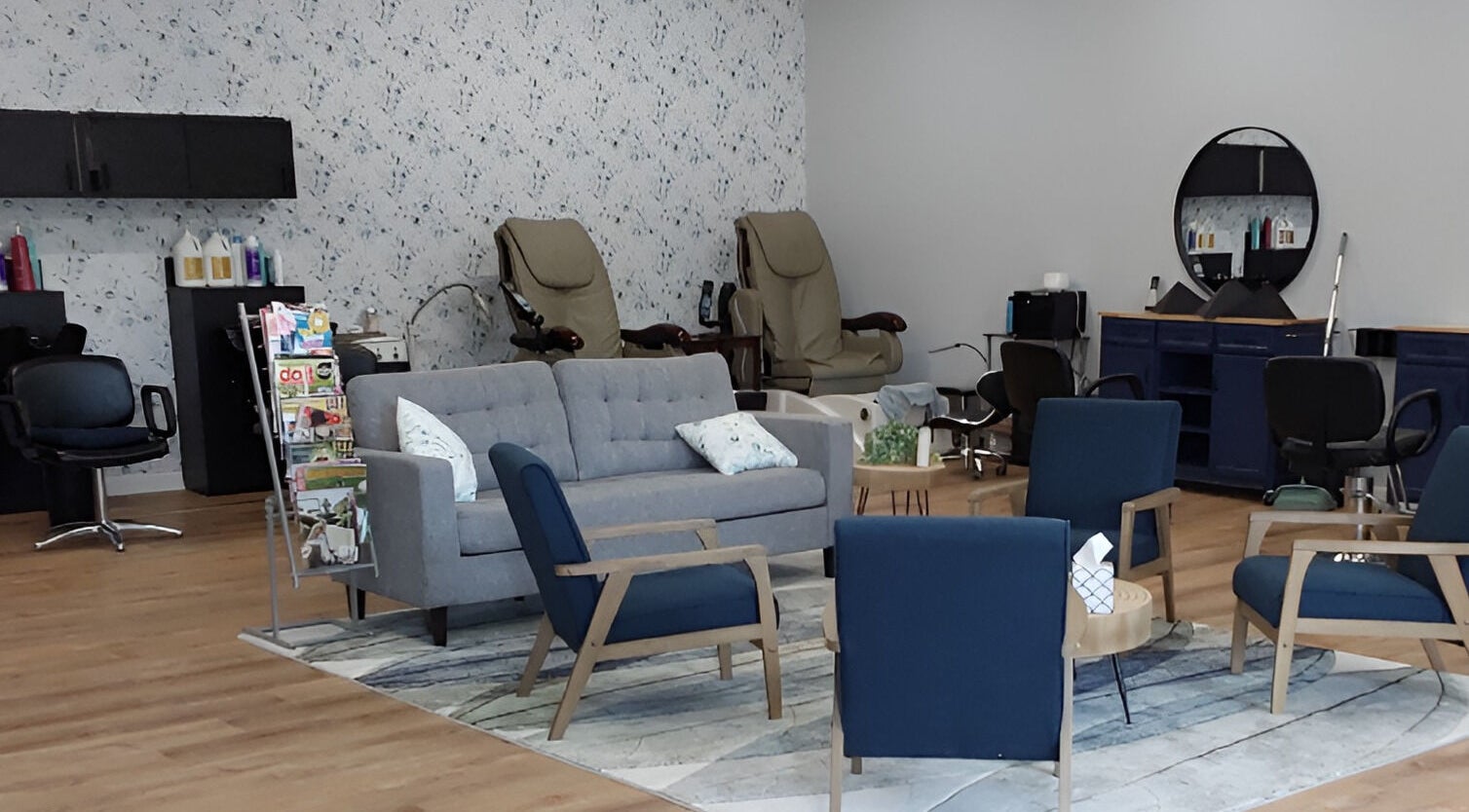 Cozy seating area at Serendipity Hair and Nails, Davison, Michigan, US, with modern decor and salon chairs.