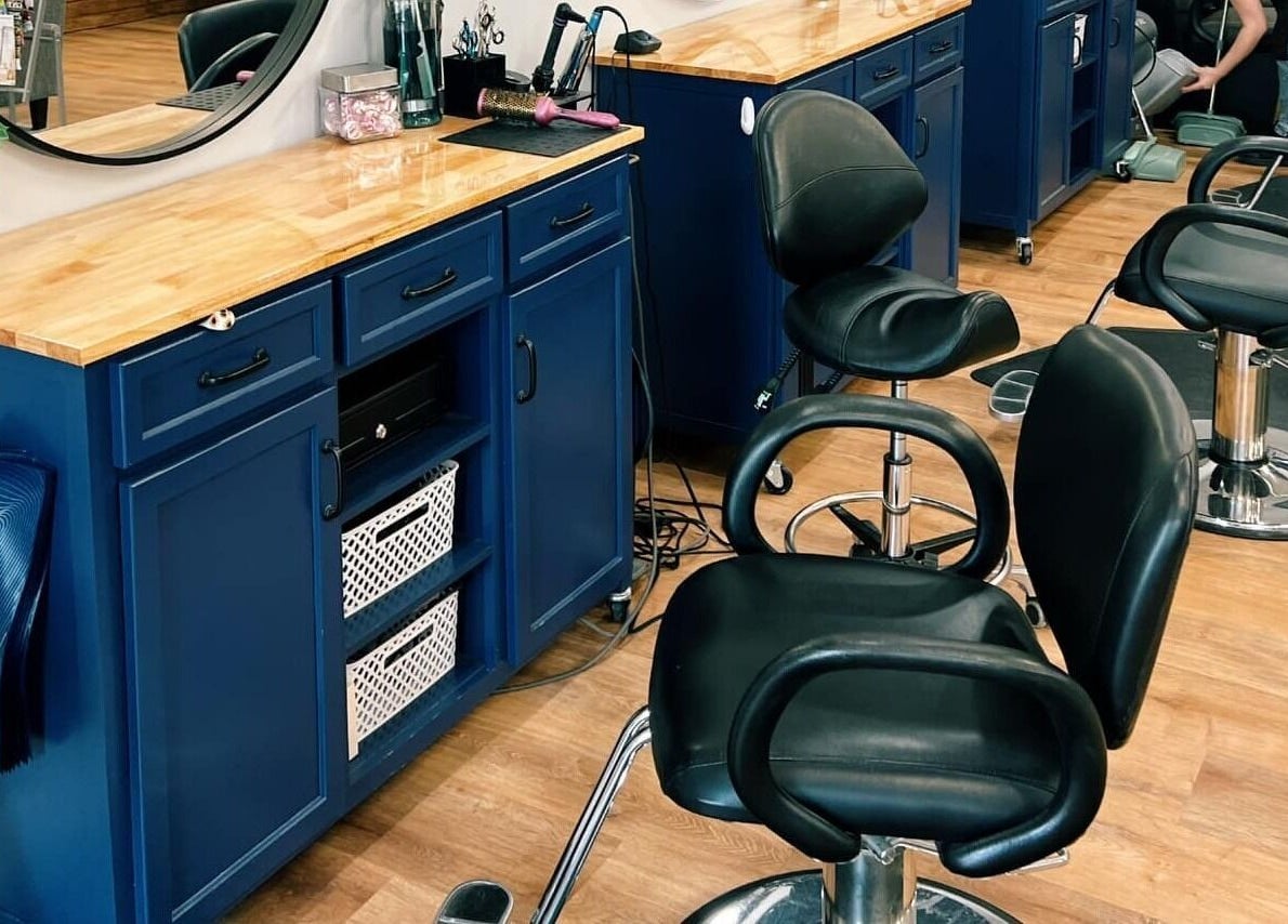 Elegant salon chairs and blue vanity at Serendipity Hair and Nails, Davison, Michigan, US.