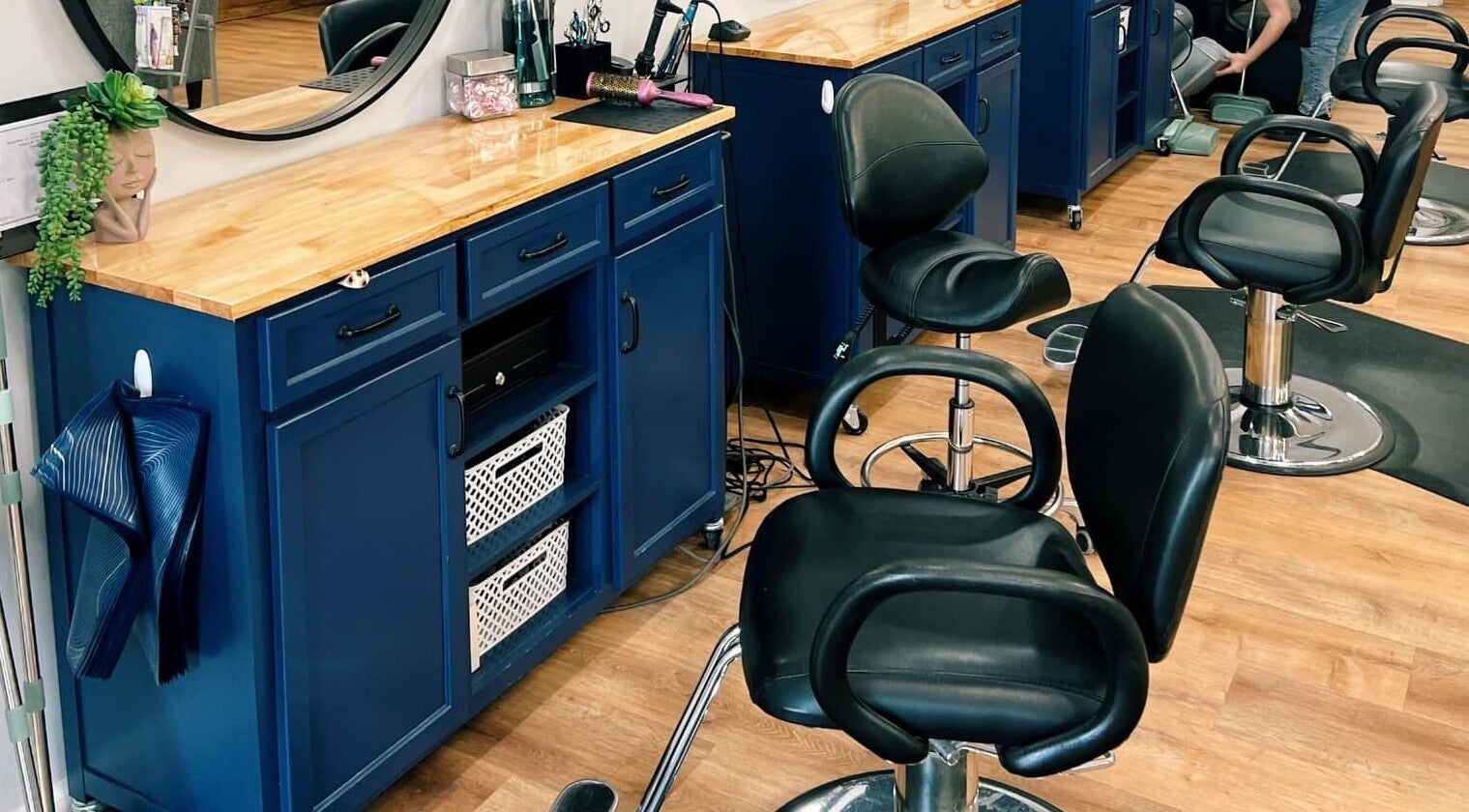 Elegant salon chairs and blue vanity at Serendipity Hair and Nails, Davison, Michigan, US.