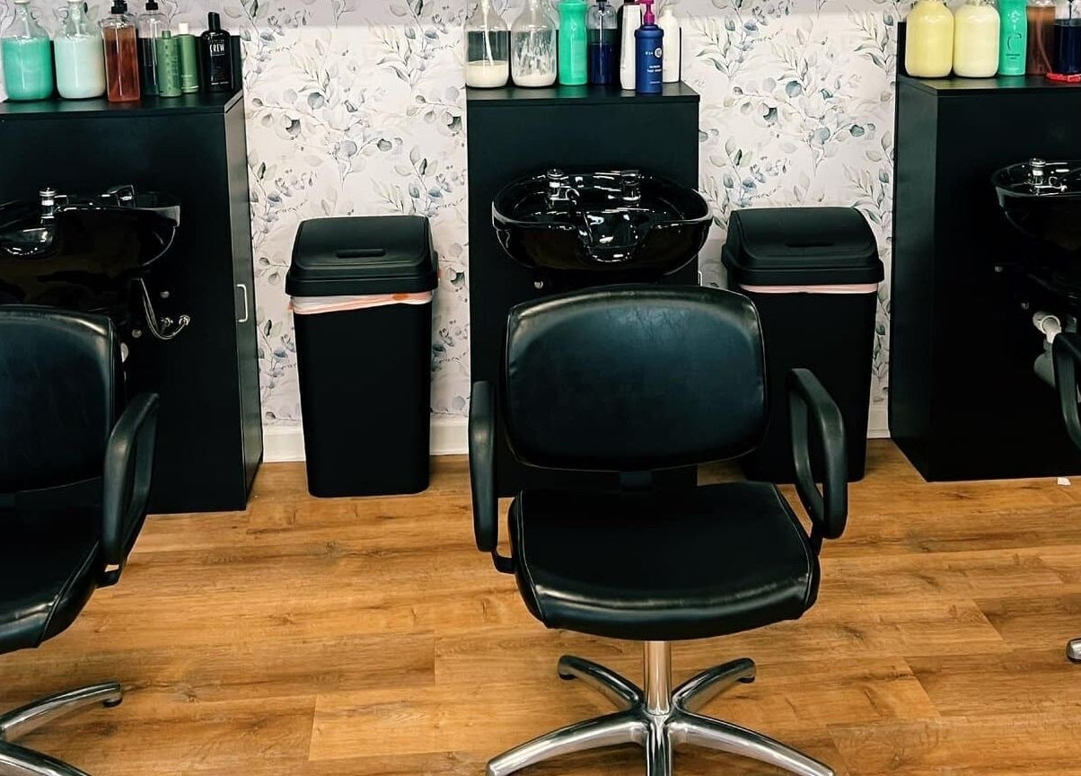 Stylish hair stations at Serendipity Hair and Nails, Davison, Michigan, showcasing modern salon chairs and equipment.