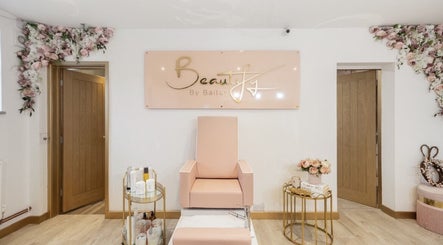 Chic interior of Beautify by Bailey, Willenhall, England, GB showcasing a stylish salon chair and floral decor.