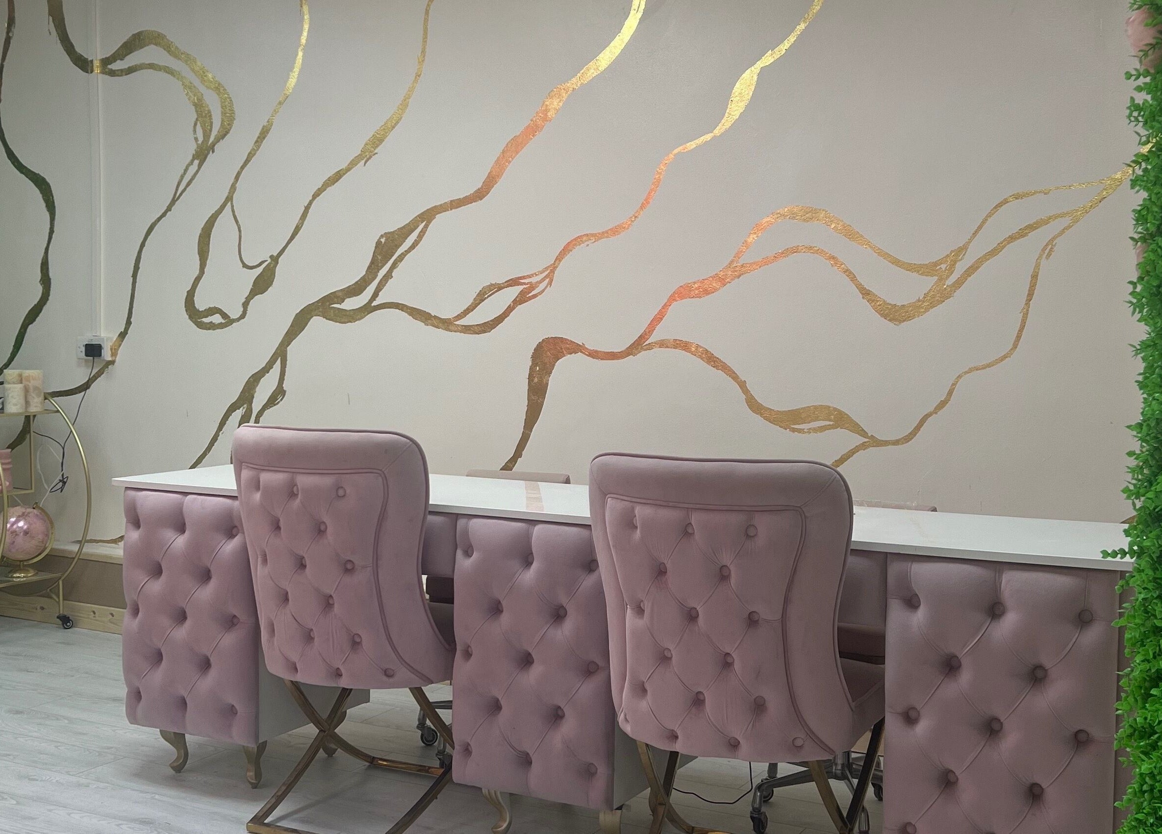 Elegant salon chairs at Beautify by Bailey, Willenhall, England, GB, featuring gold wall accents.