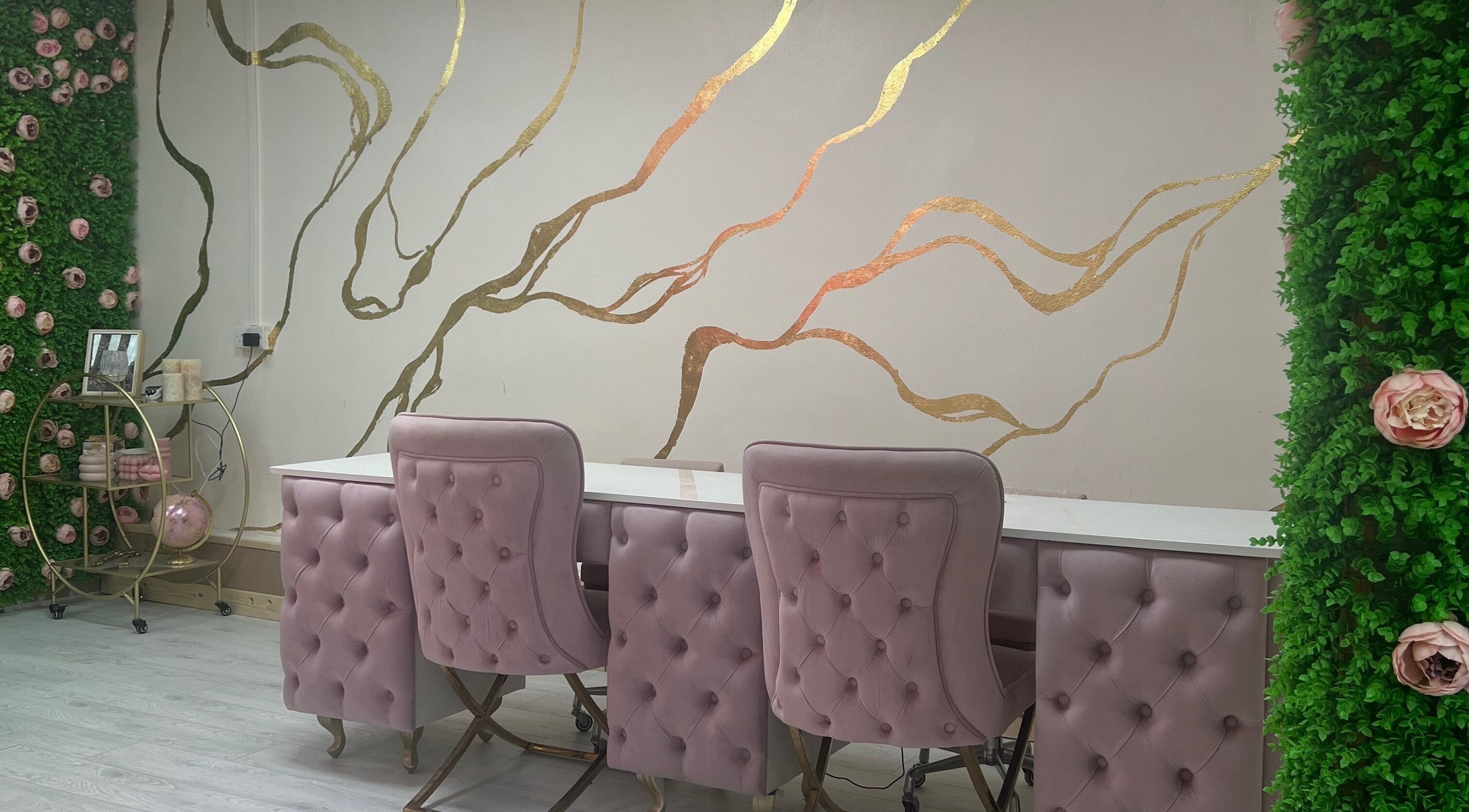 Elegant salon chairs at Beautify by Bailey, Willenhall, England, GB, featuring gold wall accents.