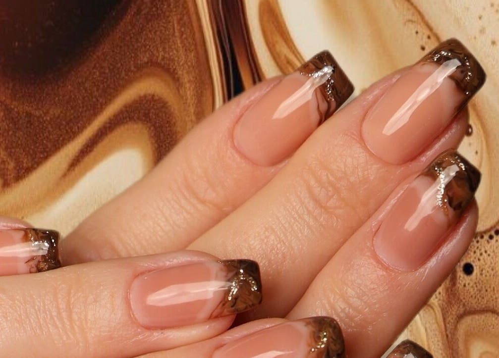 Elegant chocolate-themed nail art at Hello Lashes, Riyadh, Riyadh Province, SA, showcasing creativity.