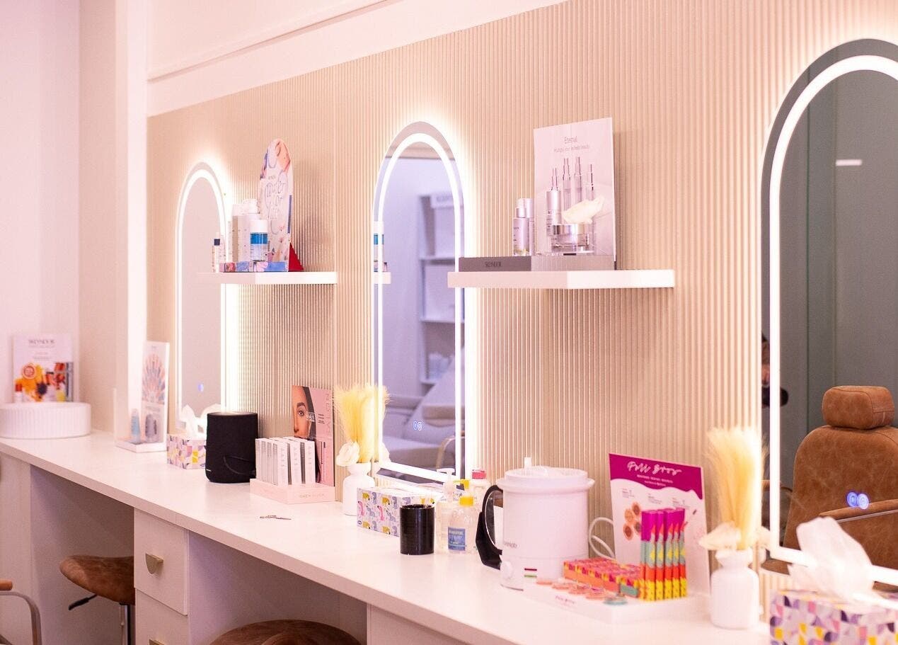 Elegant vanity at WalkIn Pamper Beauty & Brow Bar, Wagga Wagga, New South Wales, AU with chic mirrors and beauty products.