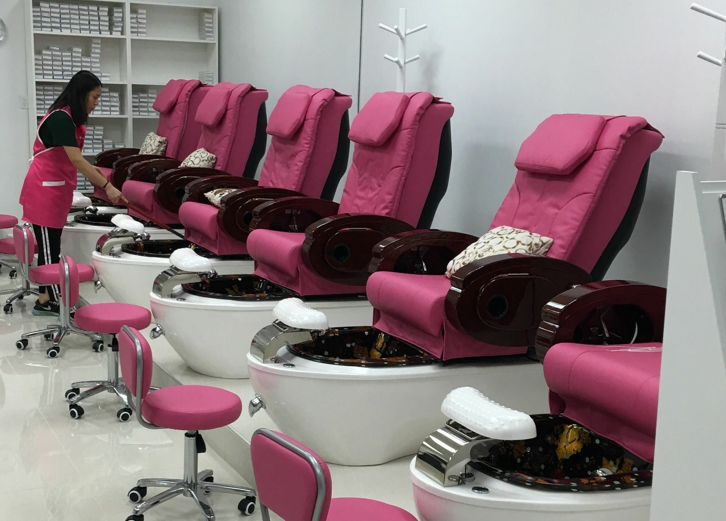 Luxurious pedicure chairs at Leah's Nails Bathurst, Newmarket, Ontario, CA with vibrant pink accents.