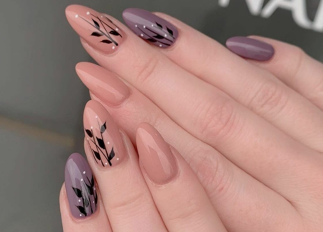 Chic nail designs at Leah's Nails Bathurst in Newmarket, Ontario, CA, featuring stylish purple and peach tones.