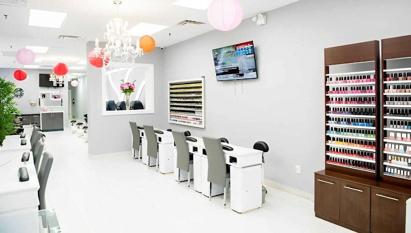 Interior of Leah's Nails Davis, showcasing stylish nail stations and vibrant polish display in Newmarket, Ontario, CA.