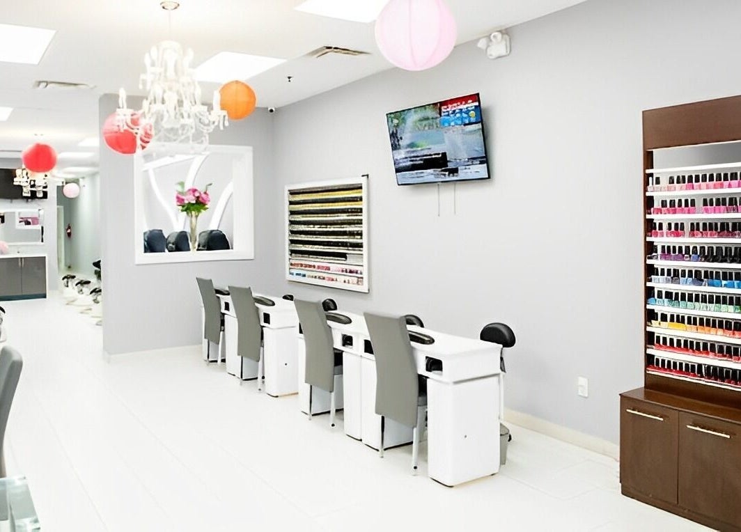 Interior of Leah's Nails Davis, showcasing stylish nail stations and vibrant polish display in Newmarket, Ontario, CA.