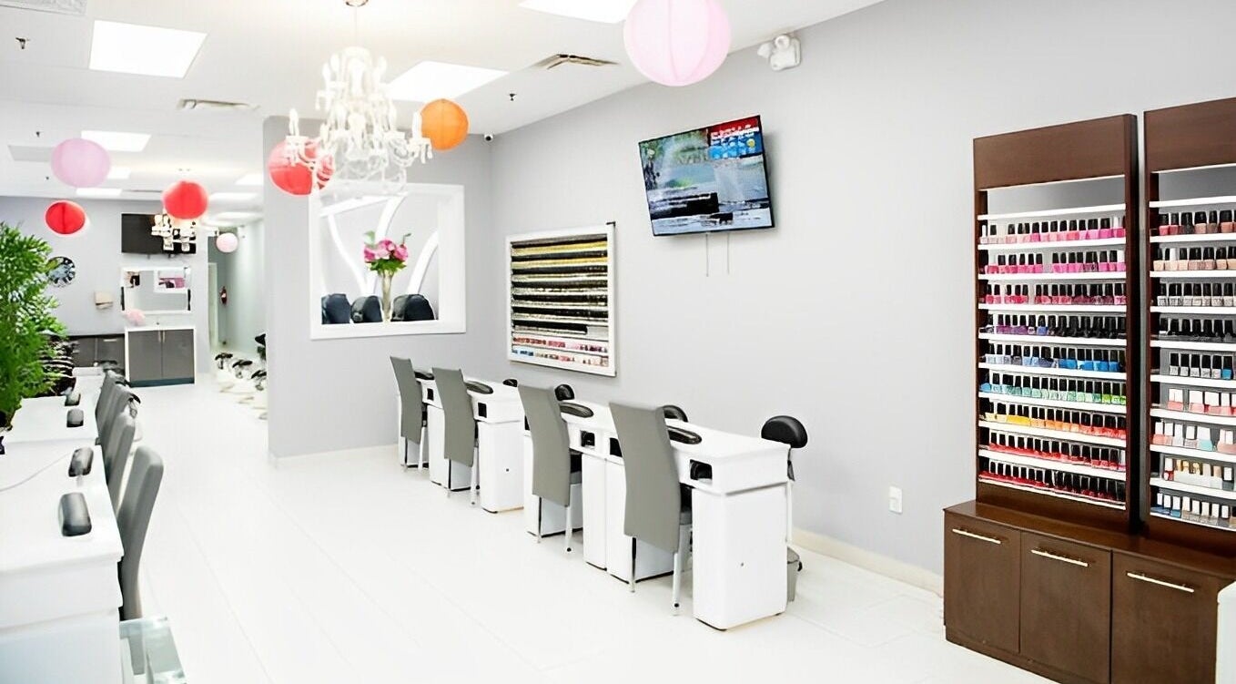 Interior of Leah's Nails Davis, showcasing stylish nail stations and vibrant polish display in Newmarket, Ontario, CA.