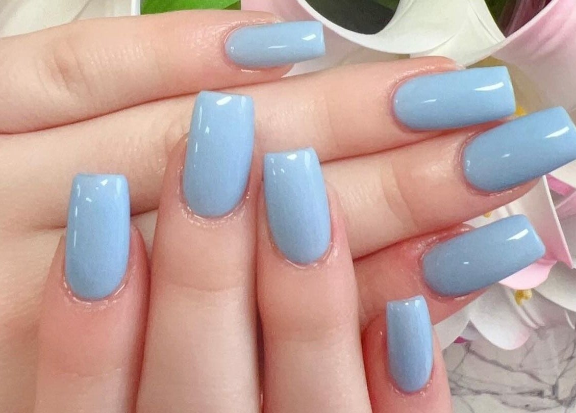 Sky-blue manicured nails at Leah's Nails Davis, Newmarket, Ontario, CA showcasing elegant nail artistry.