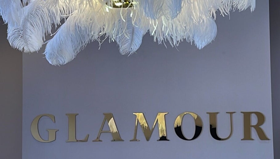 Luxurious feather chandelier with Glamour sign at Glamour, Bawtry, England, GB.