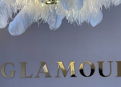 Luxurious feather chandelier with Glamour sign at Glamour, Bawtry, England, GB.