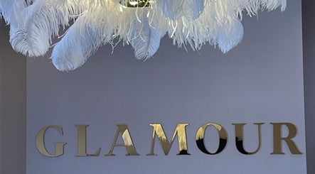Luxurious feather chandelier with Glamour sign at Glamour, Bawtry, England, GB.