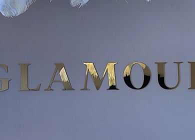 Glamour venue's gold signage in Bawtry, England, GB, highlighting modern design and elegance.