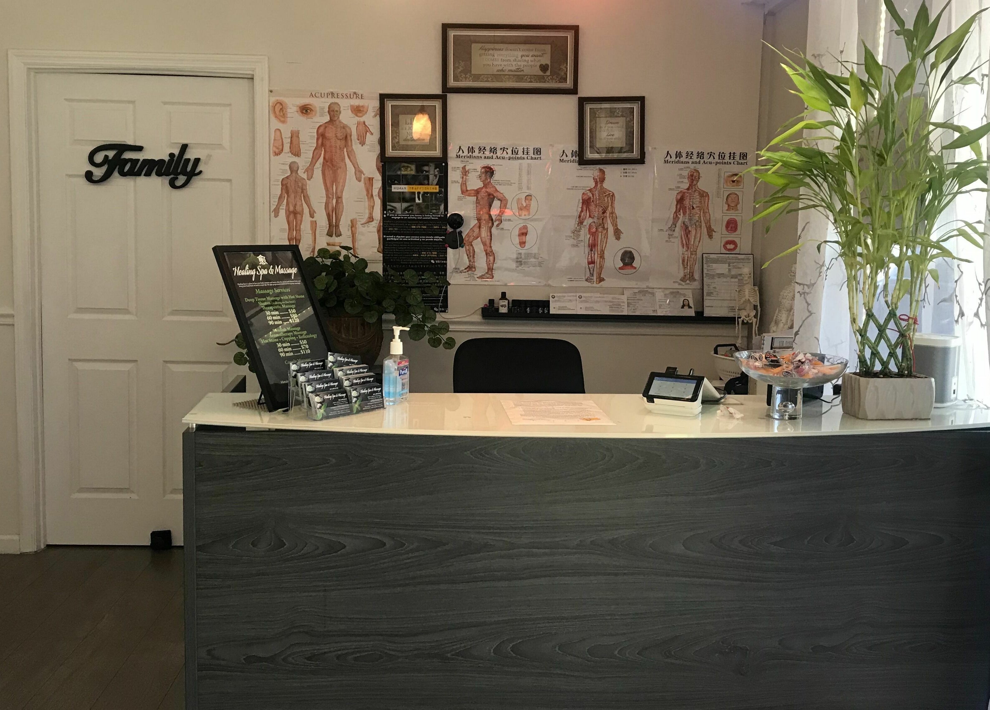 Reception area of Healing Spa & Massage in West Palm Beach, Florida, US with welcoming decor and service menu.