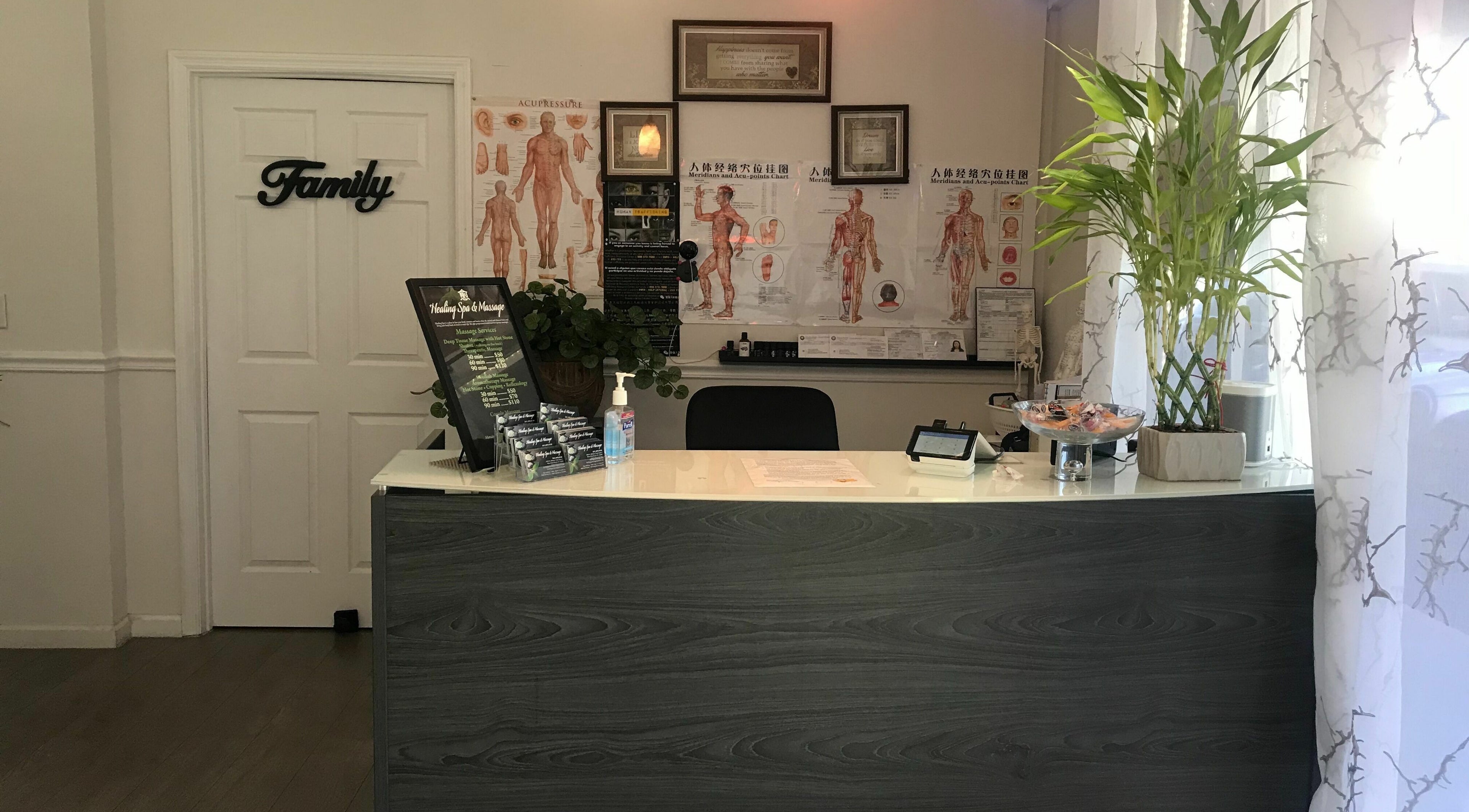 Reception area of Healing Spa & Massage in West Palm Beach, Florida, US with welcoming decor and service menu.