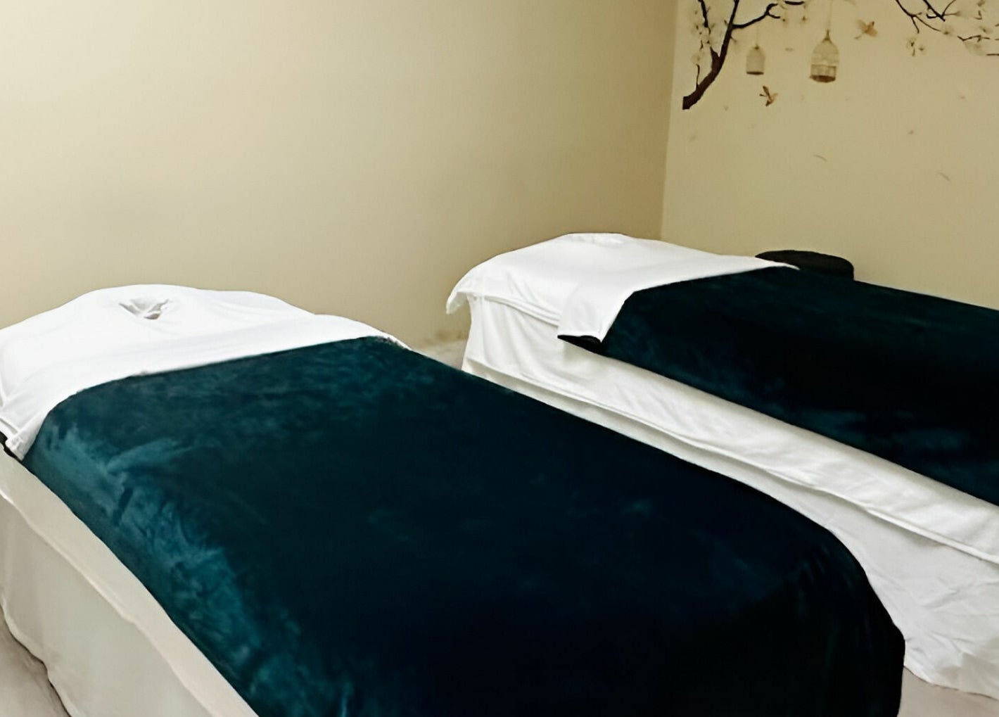 Calming massage room with two tables at Healing Spa & Massage in West Palm Beach, Florida, US.