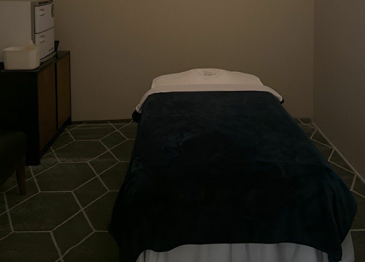 Elegant massage room at Healing Spa & Massage, West Palm Beach, Florida, US, featuring a cozy massage bed.